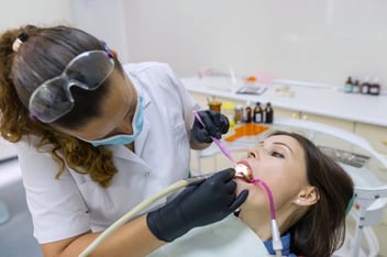 Professional t teeth cleaning in Beverly Hills with a dentist providing preventive dental care to a patient.
