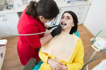 Professional teeth cleaning in Sherman Oaks with a dentist providing preventive dental care to a patient.