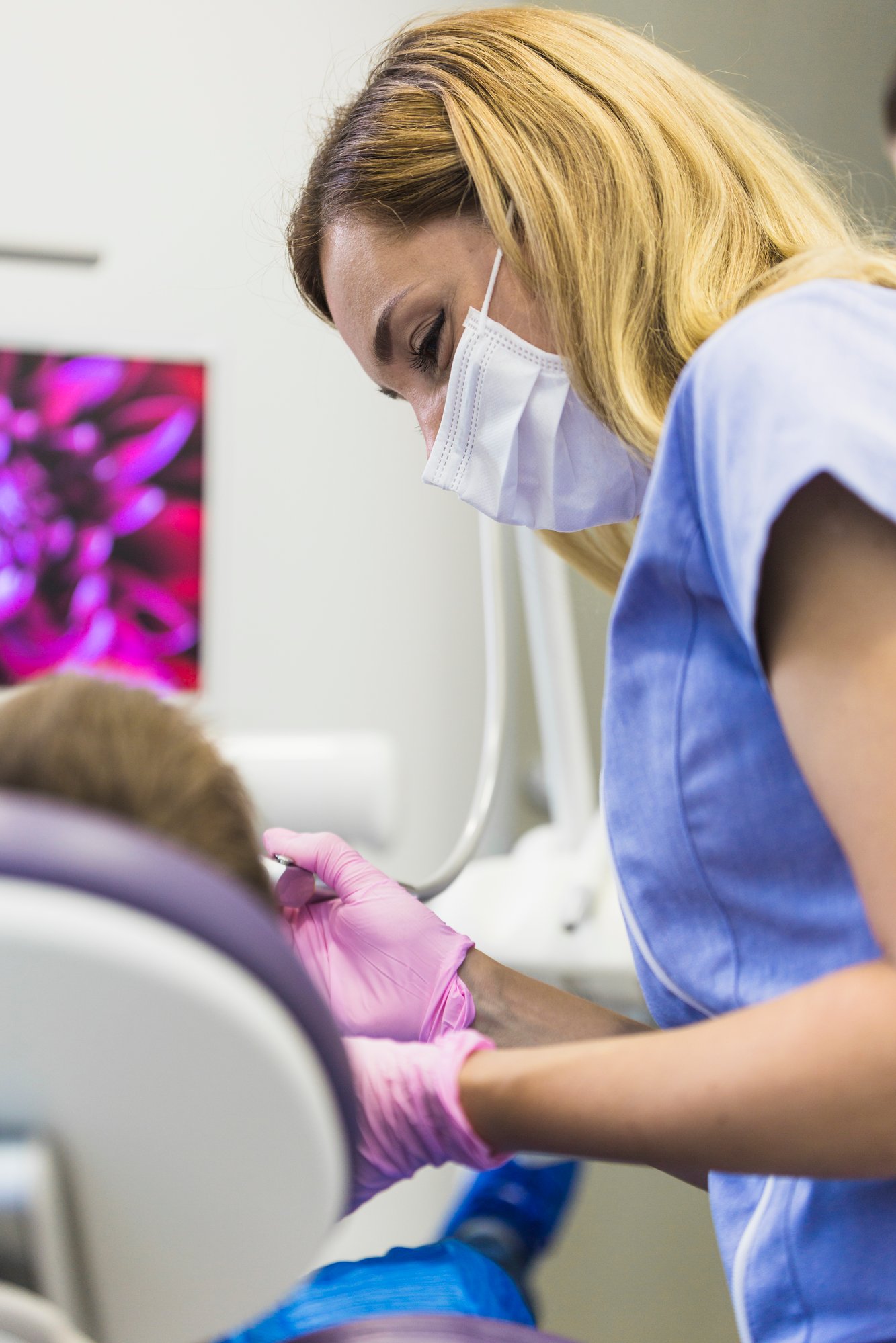 close-up-female-doctor-examining-patient-s-teeth