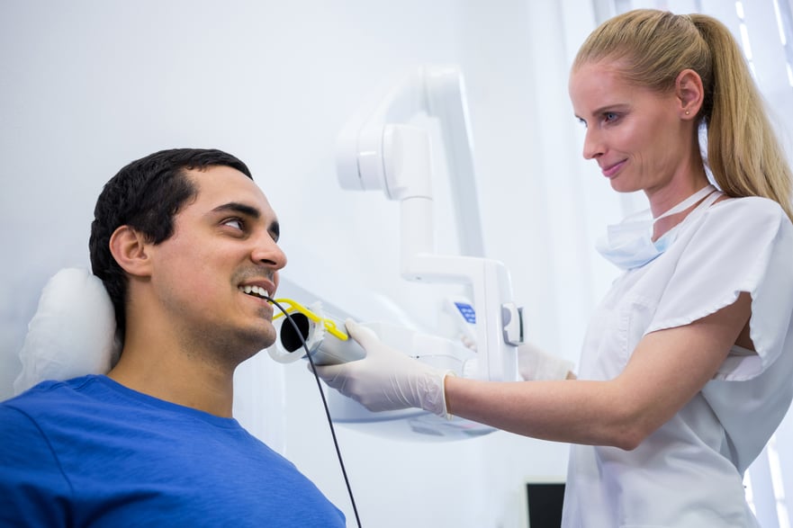 dentist-taking-male-patients-tooth-x-ray