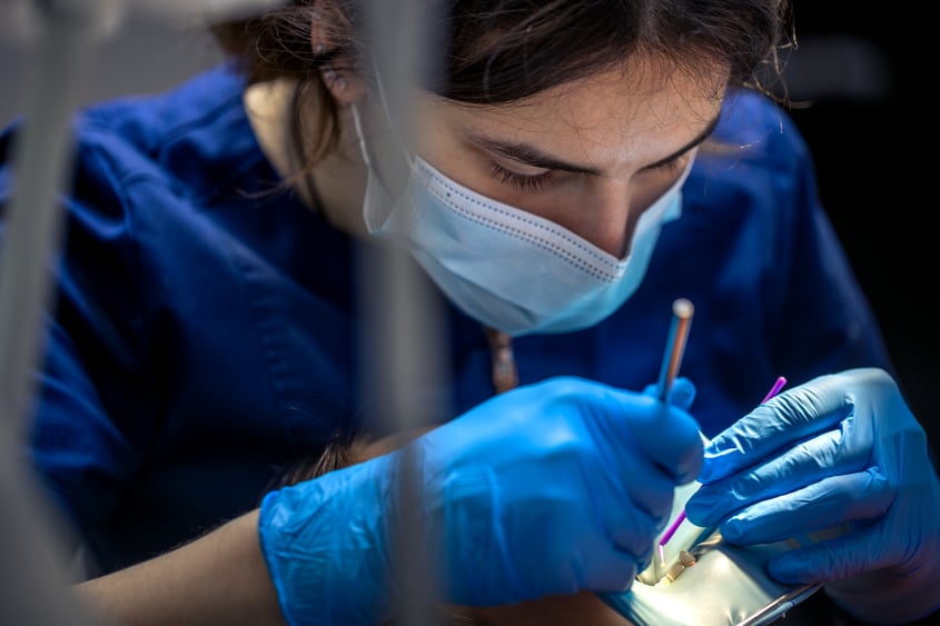 dentist-work-young-woman-dentist-treating-kid-tooth-dentistry-concept