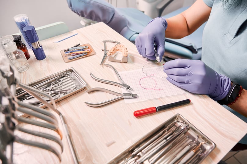 female-orthodontist-working-dental-office