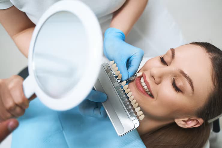 joyful-young-female-is-visiting-dentist-choosing-veneers-improving-her-smile-with-specialist-help_317809-5352(1)