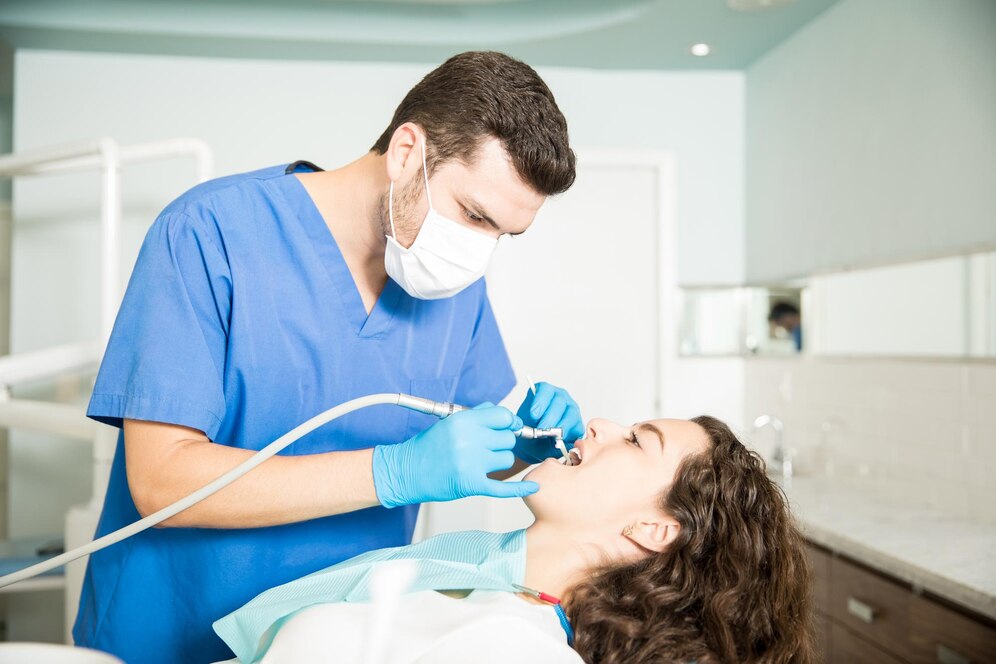 young-woman-receiving-dental-treatment-from-male-dentist-clinic_662251-2591
