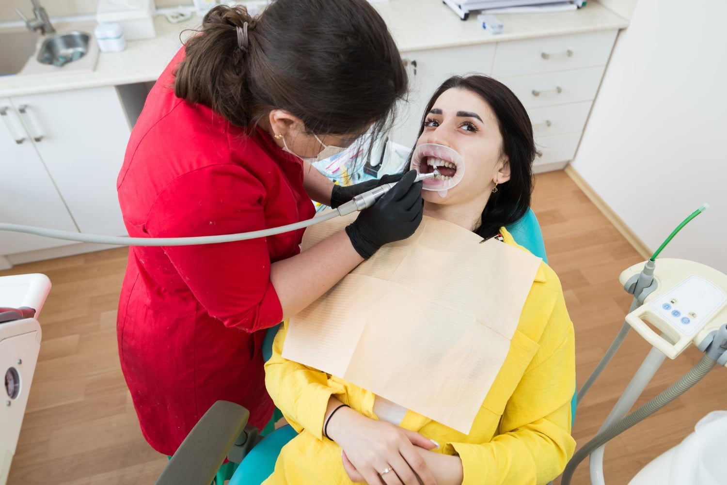 Professional teeth cleaning in Sherman Oaks with a dentist providing preventive dental care to a patient.